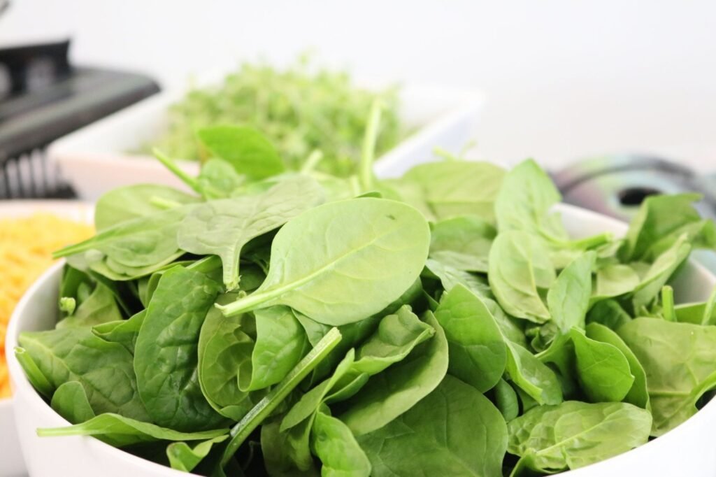 Fresh baby spinach and crumbled feta for egg muffins