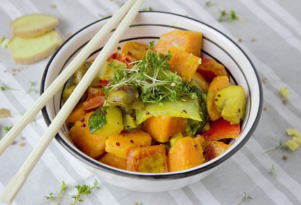 Diced sweet potato browning in a skillet for sweet potato hash